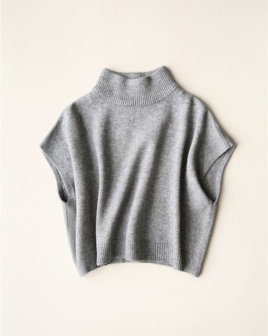 Wearing a low necked small stature with a high necked knitted pullover